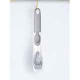 Liquid dispensing dish brush